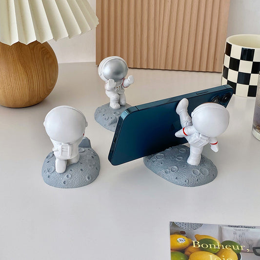 Cute Astronaut Desktop Phone Holder – Adorable Space-Themed Crater Base Stand